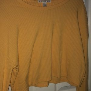 a cropped yellow shirt